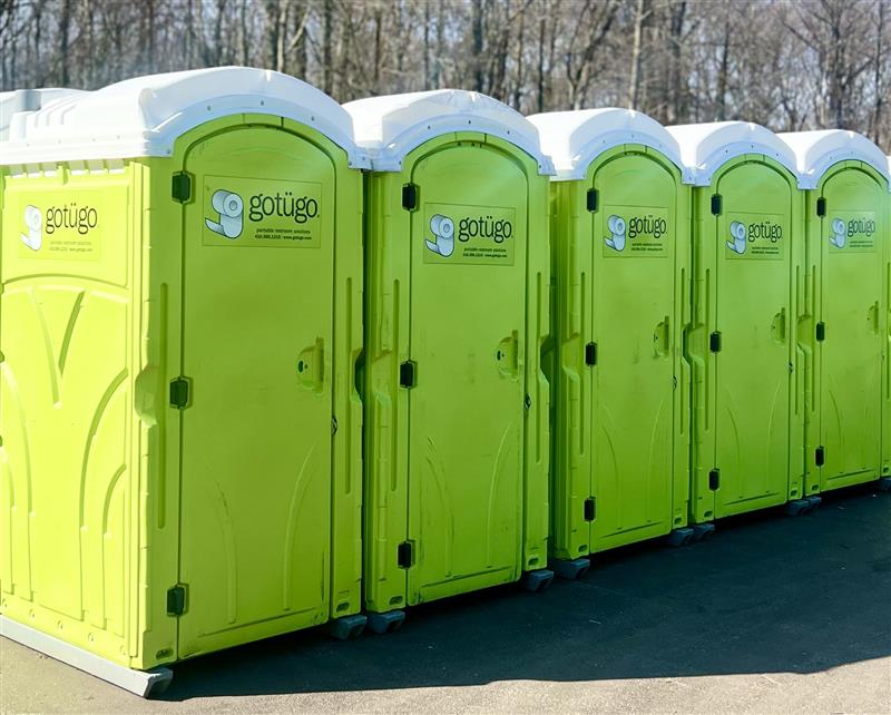 a row of portable restrooms